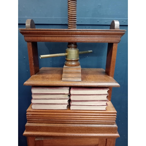 76 - Oak book press over cabinet with single blind door {H 156cm x W 66cm x D 44cm }.