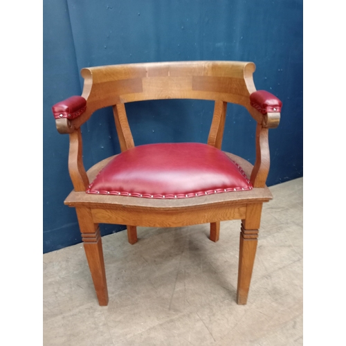 86 - Oak desk chair with red leather upholstered seat and arms {H 75cm x W 58cm x D 52cm }.