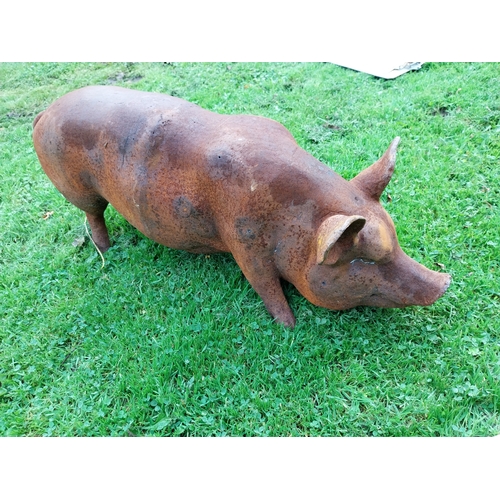 302 - Good quality large cast iron model of a pig {34cm H x 65cm W x 24cm D}