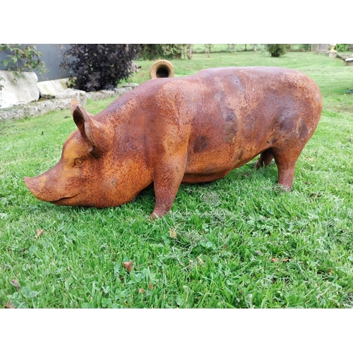 302 - Good quality large cast iron model of a pig {34cm H x 65cm W x 24cm D}