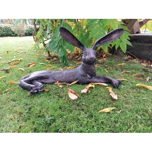 72 - Exceptional quality bronze sculpture of a hare lying down { 32cm H x  61cm W x 24cm D}