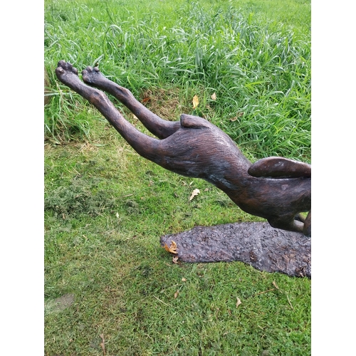 90 - Exceptional quality bronze sculpture of a leaping hare {58cm H x 88cm W x 37cm D}