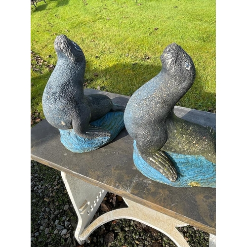 643 - Pair of composite sealions {40cm H x 33cm W x 25cm D}