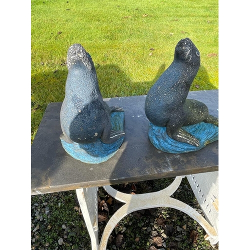 643 - Pair of composite sealions {40cm H x 33cm W x 25cm D}