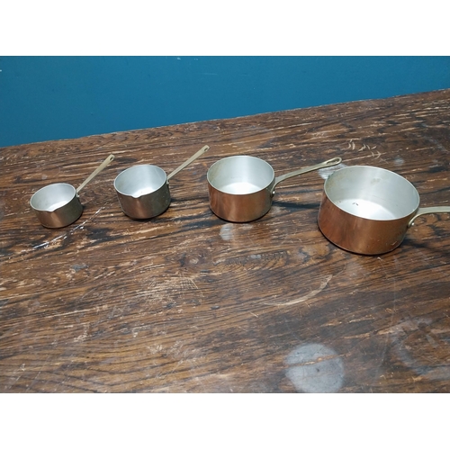 525A - Set of five copper and brass saucepans {Smallest 10cm H x 18cm W x 9cm D and Largest 14cm H x 31cm W... 