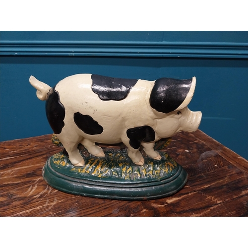 555A - Cast iron door stop in the form of a pig {22cm H x 33cm W x 10cm D}