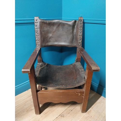 595A - Early 20th C. Oak and leather armchair {103cm H x 62cm W x 66cm D}.