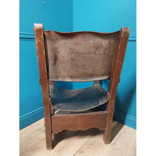 595A - Early 20th C. Oak and leather armchair {103cm H x 62cm W x 66cm D}.