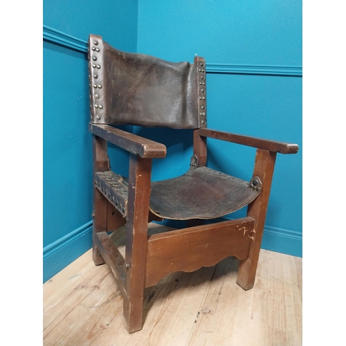 595A - Early 20th C. Oak and leather armchair {103cm H x 62cm W x 66cm D}.