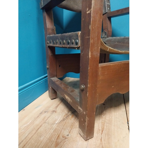 595A - Early 20th C. Oak and leather armchair {103cm H x 62cm W x 66cm D}.