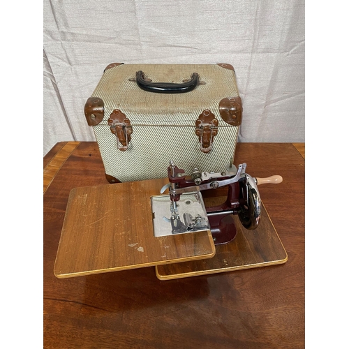 148A - Small cased sewing machine in working order.