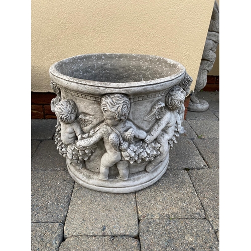 249A - Pair of circular stone planters decorated with cherubs. {32 cm H x 36 cm Dia.}.