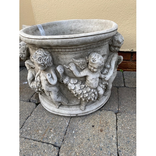 249A - Pair of circular stone planters decorated with cherubs. {32 cm H x 36 cm Dia.}.