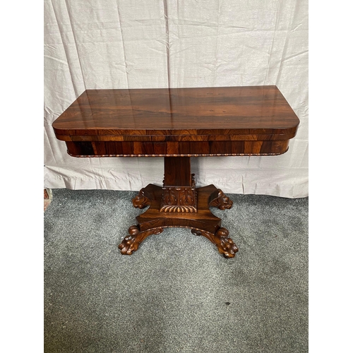 343A - Rosewood card table with square column on four carved outswept lion's paw feet. {73 cm H x 90 cm W x... 