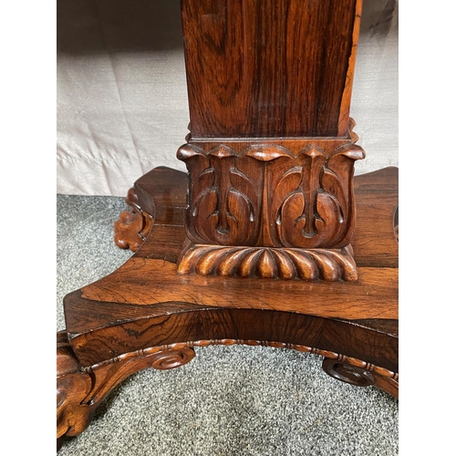 343A - Rosewood card table with square column on four carved outswept lion's paw feet. {73 cm H x 90 cm W x... 