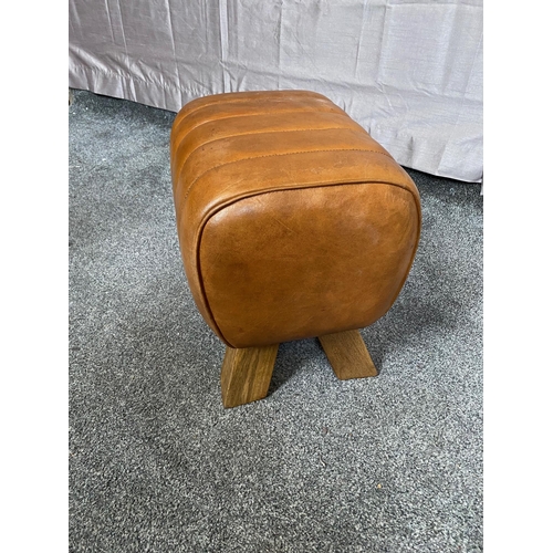 380A - Tan leather upholstered footstool. {35 cm H x 40 cm H x 29 cm D}.