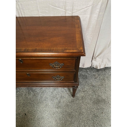 388A - Mahogany crossbanded chest of drawers with two drawers with metal mounts on four tapered legs. {81 c... 