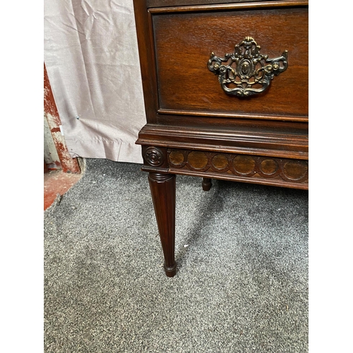 388A - Mahogany crossbanded chest of drawers with two drawers with metal mounts on four tapered legs. {81 c... 