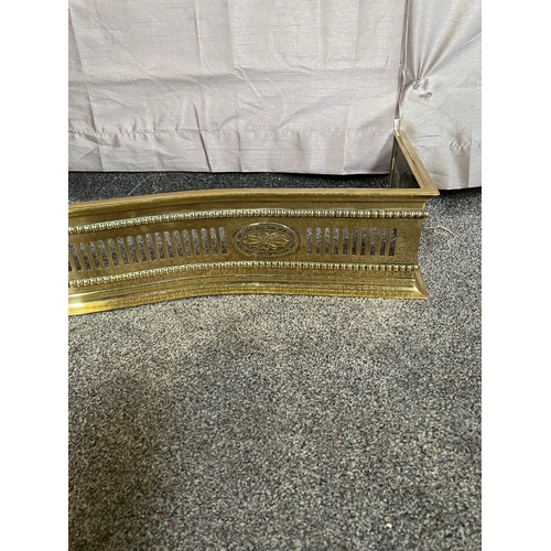 405A - Pierced brass serpentine fire fender. {129 cm W x 32 cm D}.