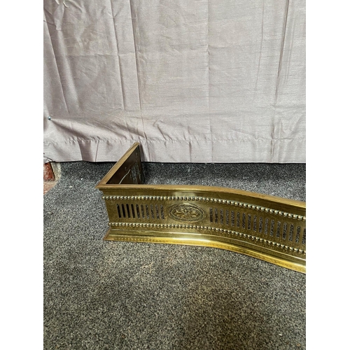 405A - Pierced brass serpentine fire fender. {129 cm W x 32 cm D}.