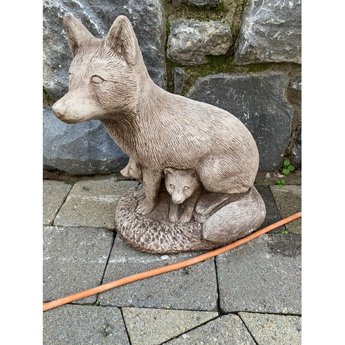 643A - Stone model of fox with cubs. {41 cm H}.