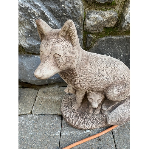 643A - Stone model of fox with cubs. {41 cm H}.