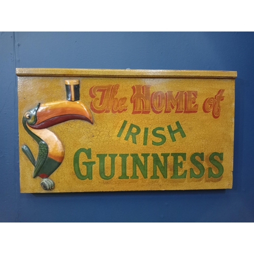 1129 - The Home of Irish Guinness painted wooden advertising board {H 43cm x W 76cm x D 6cm }.