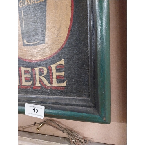 19 - Guinness Sold Here framed wooden advertising board. {37 cm H x 28 cm W}.