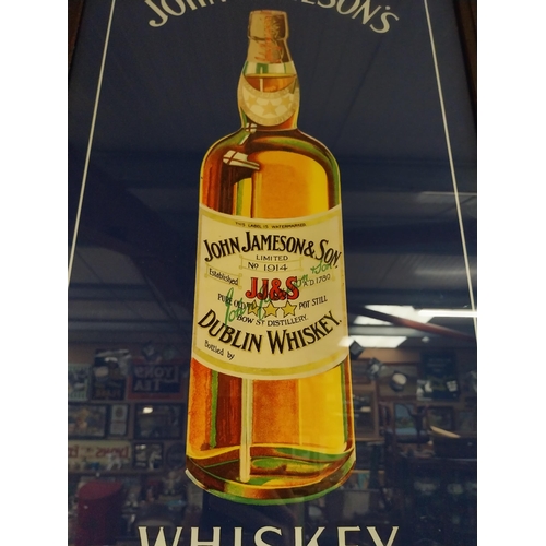 24 - John Jameson's Whiskey print in stamped oak frame. {74 cm H x 49 cm W}.