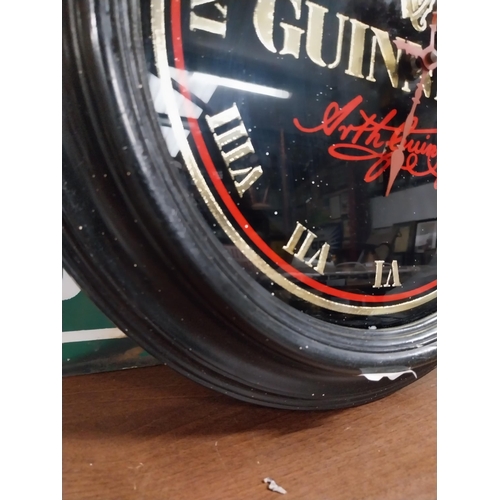 39 - Guinness advertising clock. {22 cm W}.