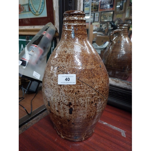 40 - 19th C. glazed stoneware flagon with damage. {24 cm H x 17 cm Dia.}.