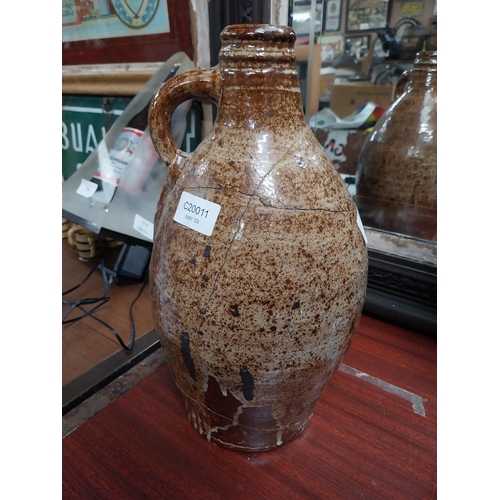 40 - 19th C. glazed stoneware flagon with damage. {24 cm H x 17 cm Dia.}.