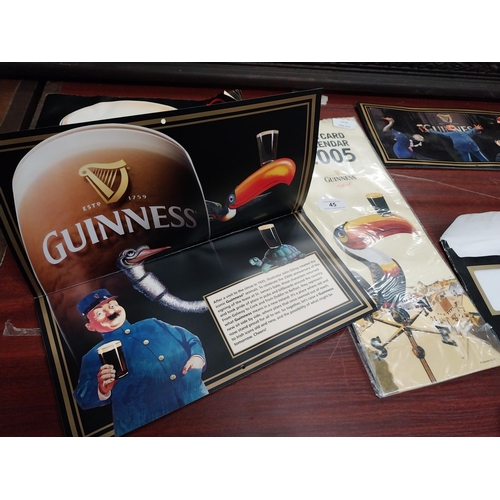 45 - Collection of three Guinness advertising calendars and The Guinness Story book.