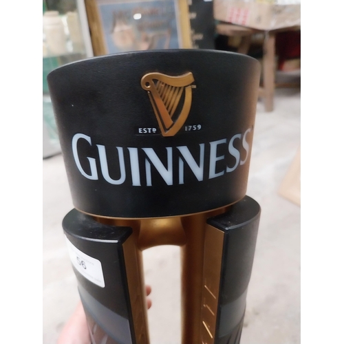 56 - Guinness  counter top bar pull. {69 cm H x 20 cm Dia.}.