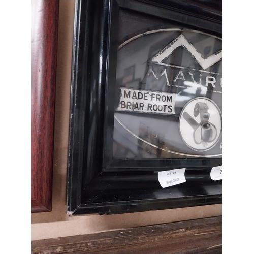 73 - Maurice Pipe Tobacco framed advertisement on reverse painted glass. {28 cm H x 27 cm W}.