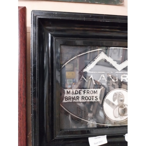 73 - Maurice Pipe Tobacco framed advertisement on reverse painted glass. {28 cm H x 27 cm W}.