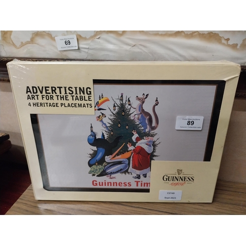 89 - Four Guinness Heritage placemats. {23 cm H x 31 cm W}