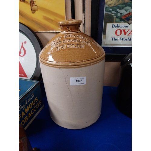 807 - Kelly Brothers Wine Merchants Dublin stoneware flagon. {31 cm H x 18 cm Dia.}.