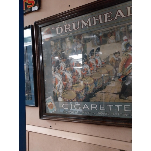 810 - Drumhead Cigarettes pictorial advertising showcard mounted in oak frame {50 cm H x 60 cm W}.