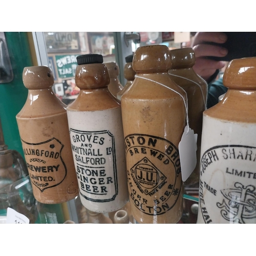 1126 - Four 19th C. stoneware ginger beer bottles - Groves and Whitnall, Wallingford Brewery, Urmston Bros ... 