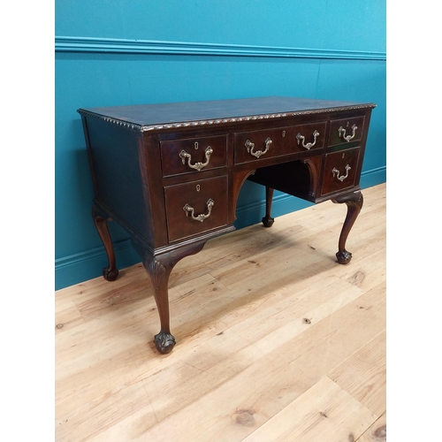 137 - Edwardian mahogany desk with inset leather top and brass handles raised on cabriole legs and ball an... 