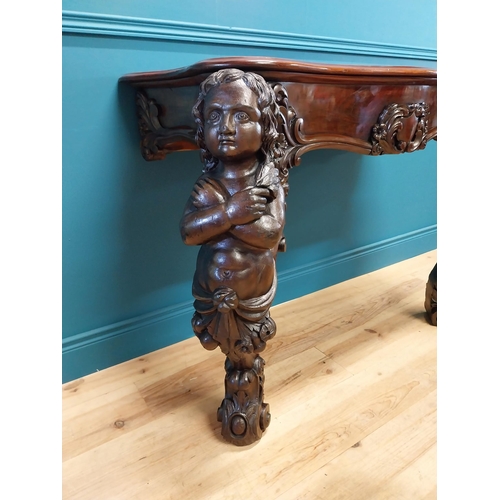 147 - Good quality Italian Victorian mahogany and carved pine console table decorated with cherubs raised ... 