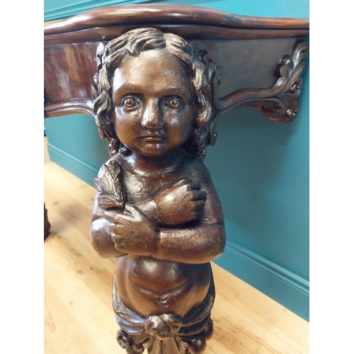 147 - Good quality Italian Victorian mahogany and carved pine console table decorated with cherubs raised ... 