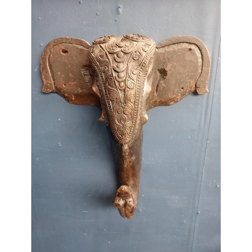 155 - Carved ebony elephant head. {H 52cm x W47cm x D 15cm }.