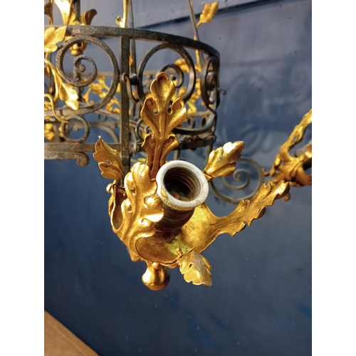 173 - Decorative gilded brass chandelier. {H 126cm x W90vm x D 46cm }.