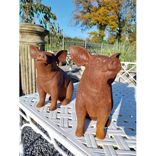 200 - Two cast iron models of pigs. {29 cm H x 17 cm W x 28 cm D}.