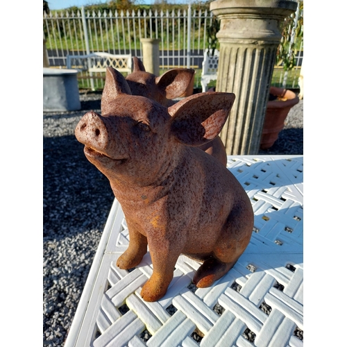 200 - Two cast iron models of pigs. {29 cm H x 17 cm W x 28 cm D}.