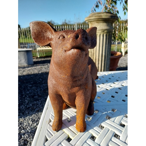 200 - Two cast iron models of pigs. {29 cm H x 17 cm W x 28 cm D}.