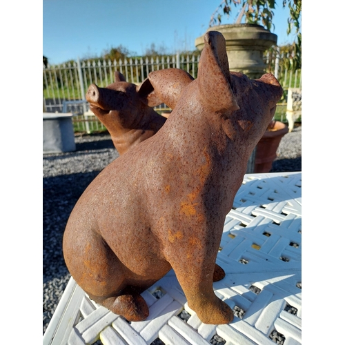 200 - Two cast iron models of pigs. {29 cm H x 17 cm W x 28 cm D}.