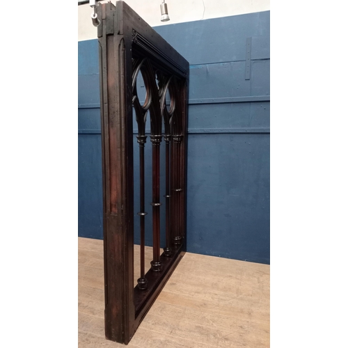 241 - Carved oak divider in the Gothic style. {H 240cm x W 18cm x D 174cm}.